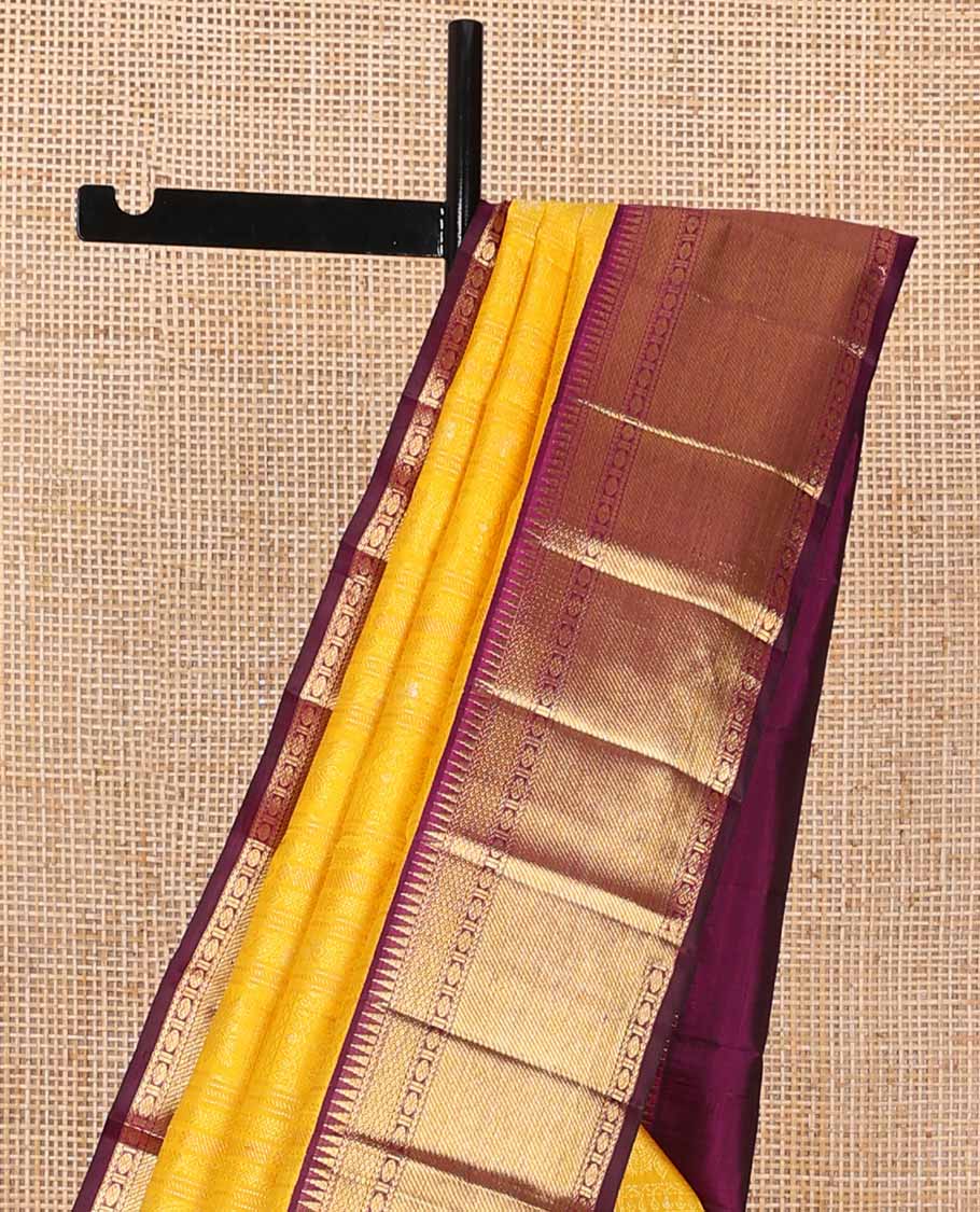 Yellow floral design silk saree with contrast border of rekku, paun, mayil kann design & jaal design pallu