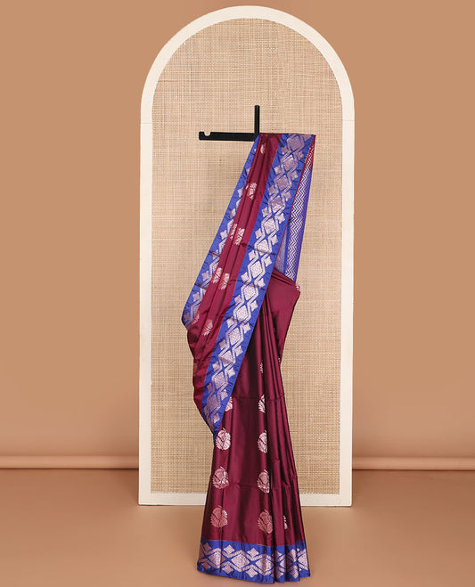 Maroon semi-soft silk saree with zari floral buttas, contrast diamond design zari border & chevron striped pallu