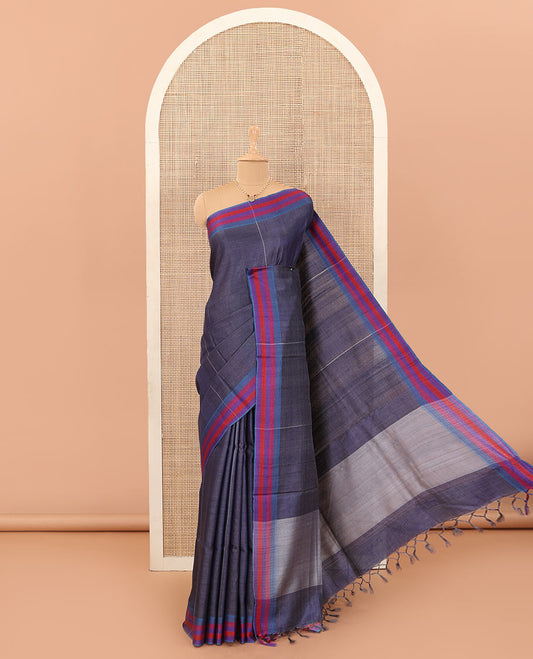 Navy blue vertically striped tussar silk saree with contrast thread woven border, and plain pallu