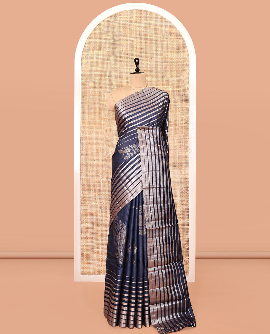 Borderless Blue Tussar Silk Saree, Gracefully Embellished with Zari Stripes and Floral Buttas, Striped Pallu, and a Matching Blouse