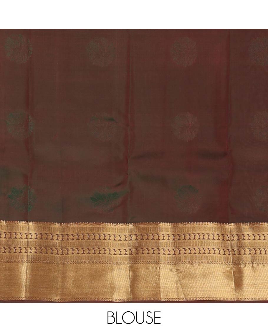 Maroon zari buttas Vasundhara silk mix saree, contrast border of thilakam, mayil kann, diamond, and manga designs, and geometric patterned pallu