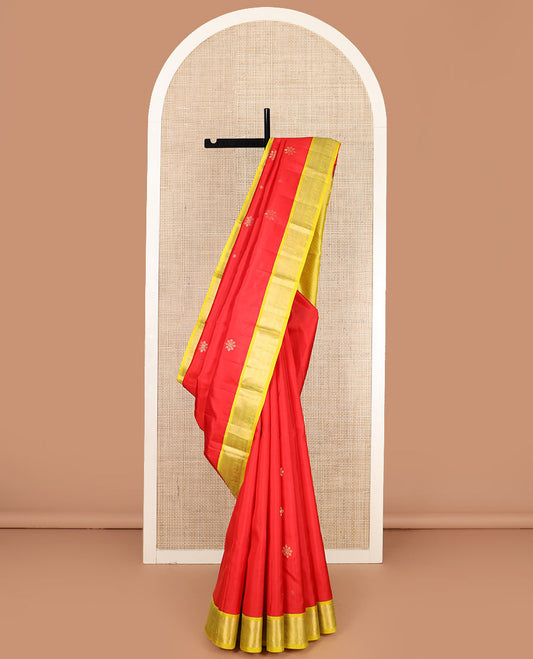 Red buttas silk saree, contrast border of rekku, neli, and mayil designs, and jaal pallu