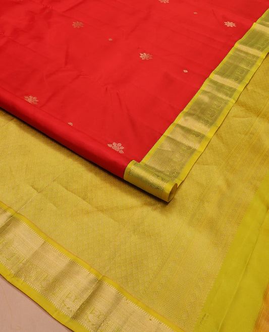 Red buttas silk saree, contrast border of rekku, neli, and mayil designs, and jaal pallu