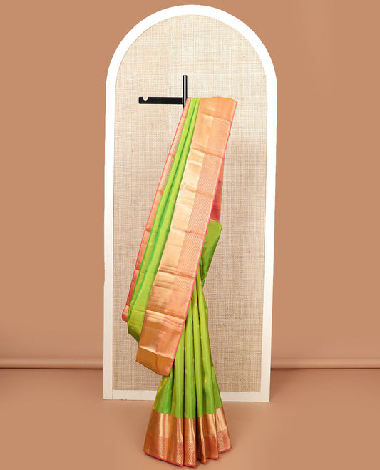 Leaf green zari buttas silk saree, contrast zari border of vanki designs, and jaal pallu