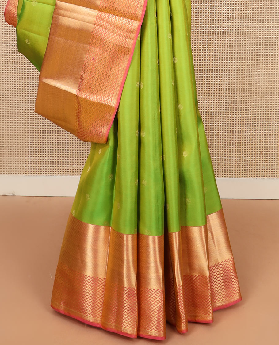 Leaf green zari buttas silk saree, contrast zari border of vanki designs, and jaal pallu