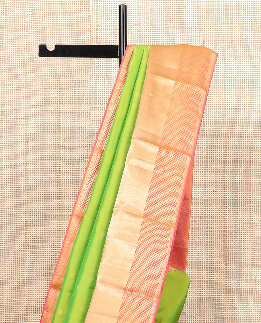 Leaf green zari buttas silk saree, contrast zari border of vanki designs, and jaal pallu
