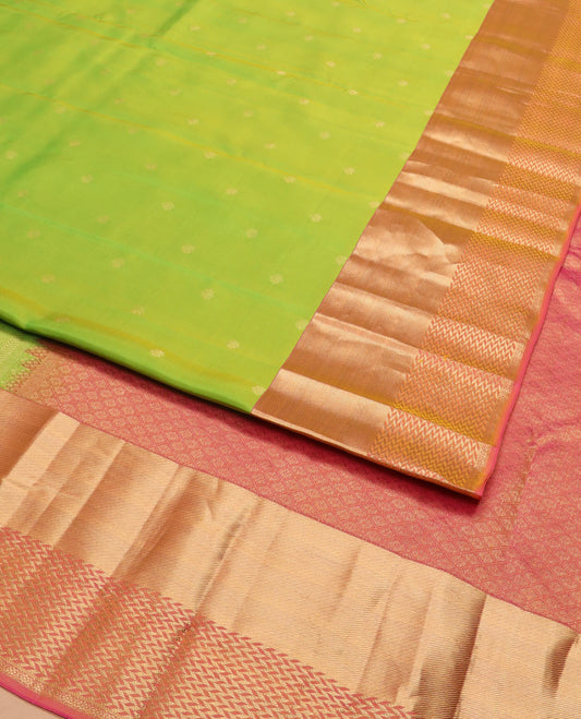 Leaf green zari buttas silk saree, contrast zari border of vanki designs, and jaal pallu