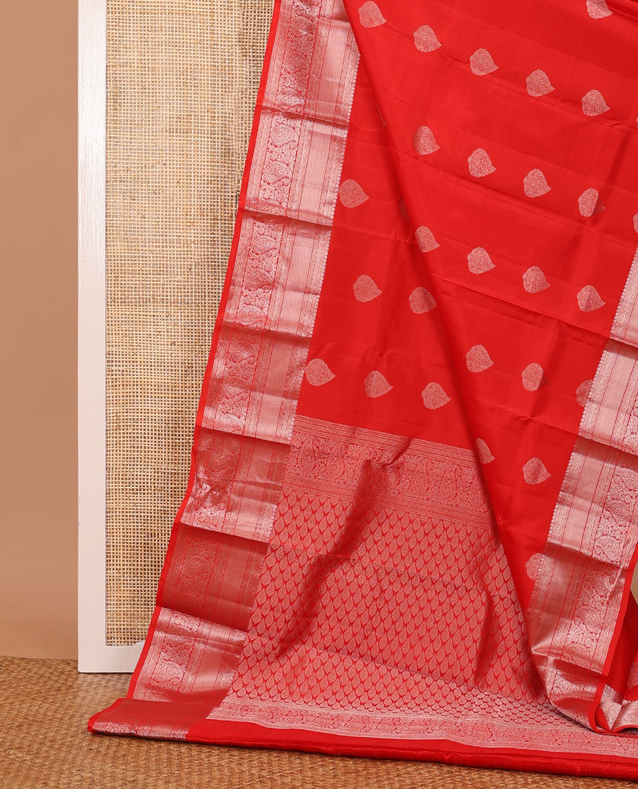 Red zari buttas silksaree, zari border of manga mokku,muthu,puli nagam, floral & manga design & zari elevated pallu of leaf motifs