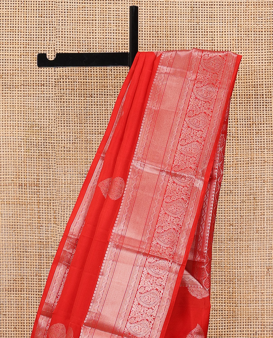 Red zari buttas silksaree, zari border of manga mokku,muthu,puli nagam, floral & manga design & zari elevated pallu of leaf motifs