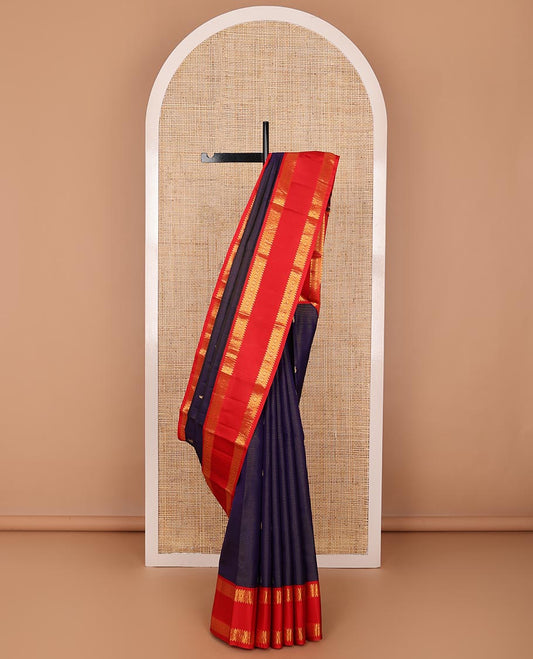 Blue zari striped & buttas silksaree, contrast rettai pettu border of thilakam,banaras,muthu & chakram design & jaal pallu