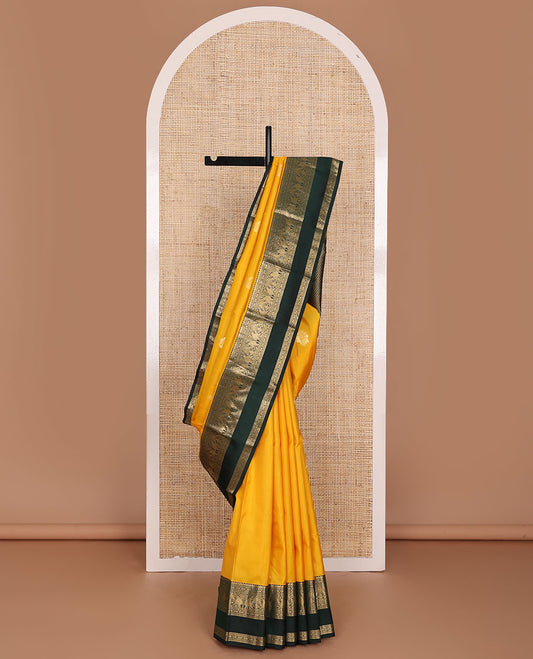 Yellow zari buttas silk saree, contrast rettai pettu border of salngai,banaras,muthu,kili & yaanai designs & jaal pallu
