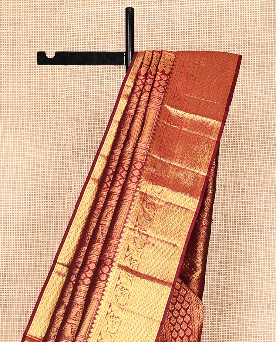 Maroon Kanchipuram Wedding Silk Saree, Embellished with Jacquard Design, Zari Border of Thilakam Mokku, Manga, and Mayil Kann Designs, Grand Pallu, and a Matching Blouse