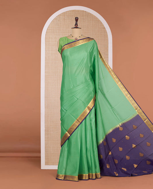 Green Mysore Silk Saree, Gleamed Up with Zari Buttas All Over Its Body, Complemented by a Contrast Traditional Zari Design Border, Zari-Buttas Woven Pallu, and Paired with a Contrast Blouse