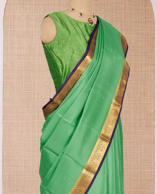 Green Mysore Silk Saree, Gleamed Up with Zari Buttas All Over Its Body, Complemented by a Contrast Traditional Zari Design Border, Zari-Buttas Woven Pallu, and Paired with a Contrast Blouse