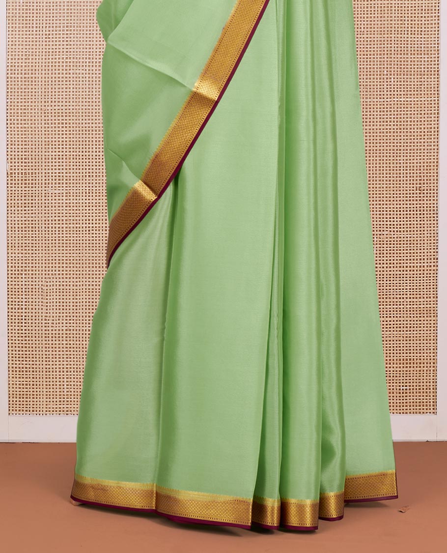 Green Plain Mysore Silk Saree, Complemented by a Contrast Traditional Zari Design Border, Zari-Striped Pallu, and Paired with a Contrast Blouse