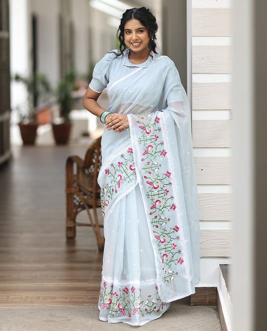 Light Blue  Kota Doria Saree, Subtly Sparkled With Buttas, a Floral-Bird Thread Work Border, a Self-Pallu, a Matching Blouse