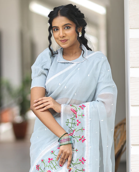 Light Blue  Kota Doria Saree, Subtly Sparkled With Buttas, a Floral-Bird Thread Work Border, a Self-Pallu, a Matching Blouse