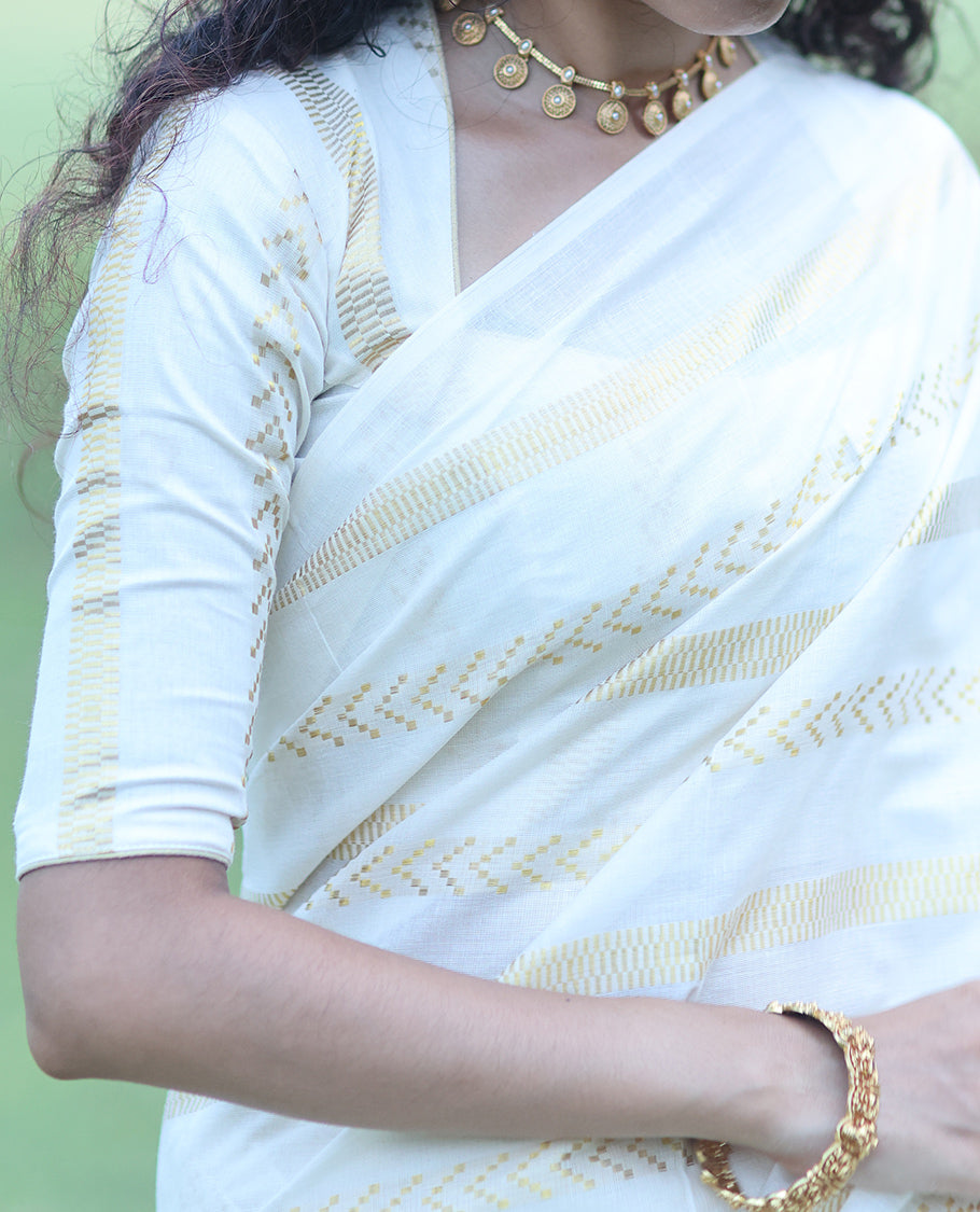 Borderless Cream Kerala Tissue Saree, Richly Detailed with Geometric Zari Stripes, and a Matching Blouse