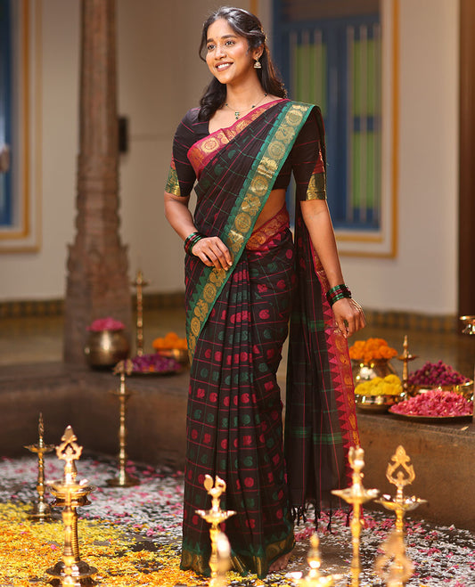 Black Chettinad Cotton Saree Features Butta Enclosed Checks, a Contrast Temple Annam-Peacock Ganga-Jamuna Border, and a Matching Blouse