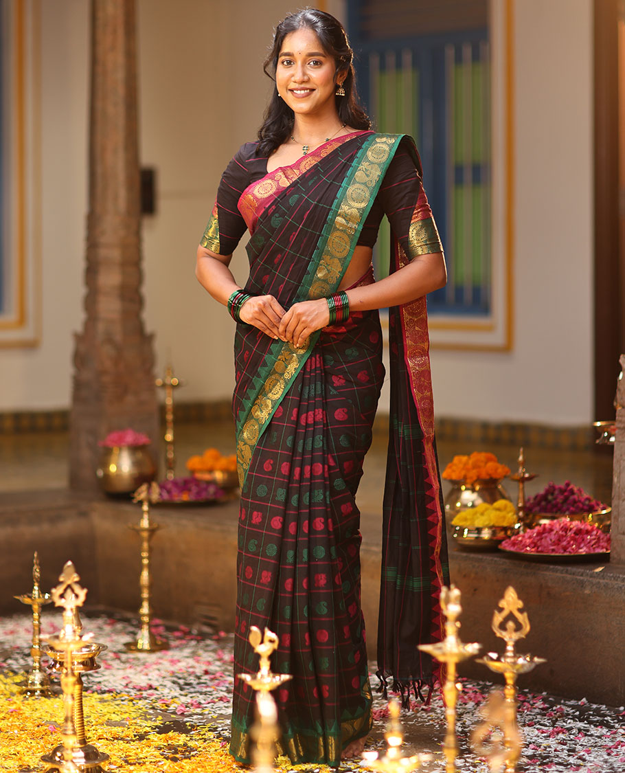 Black Chettinad Cotton Saree Features Butta Enclosed Checks, a Contrast Temple Annam-Peacock Ganga-Jamuna Border, and a Matching Blouse