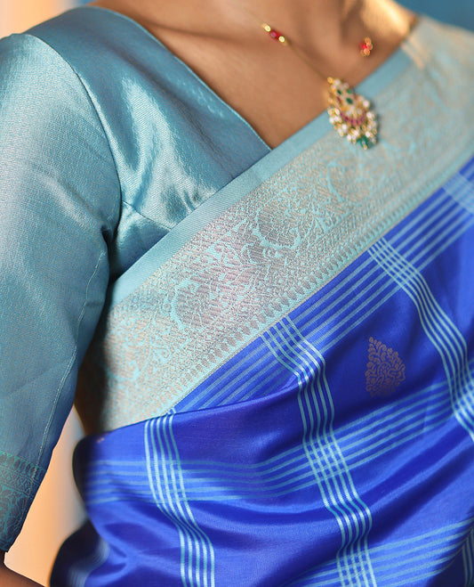 Blue Art Kanchi Silk Saree Features Butta Enclosed Checks, a Contrast Temple Rettai Pettu Border, Grand Pallu, and a Contrast Blouse