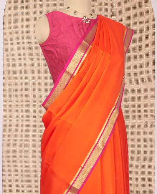 Orange Plain Mysore Silk Saree, Complemented by a Contrast Traditional Zari Design Border, Zari Striped Pallu, and Paired with a Contrast Blouse