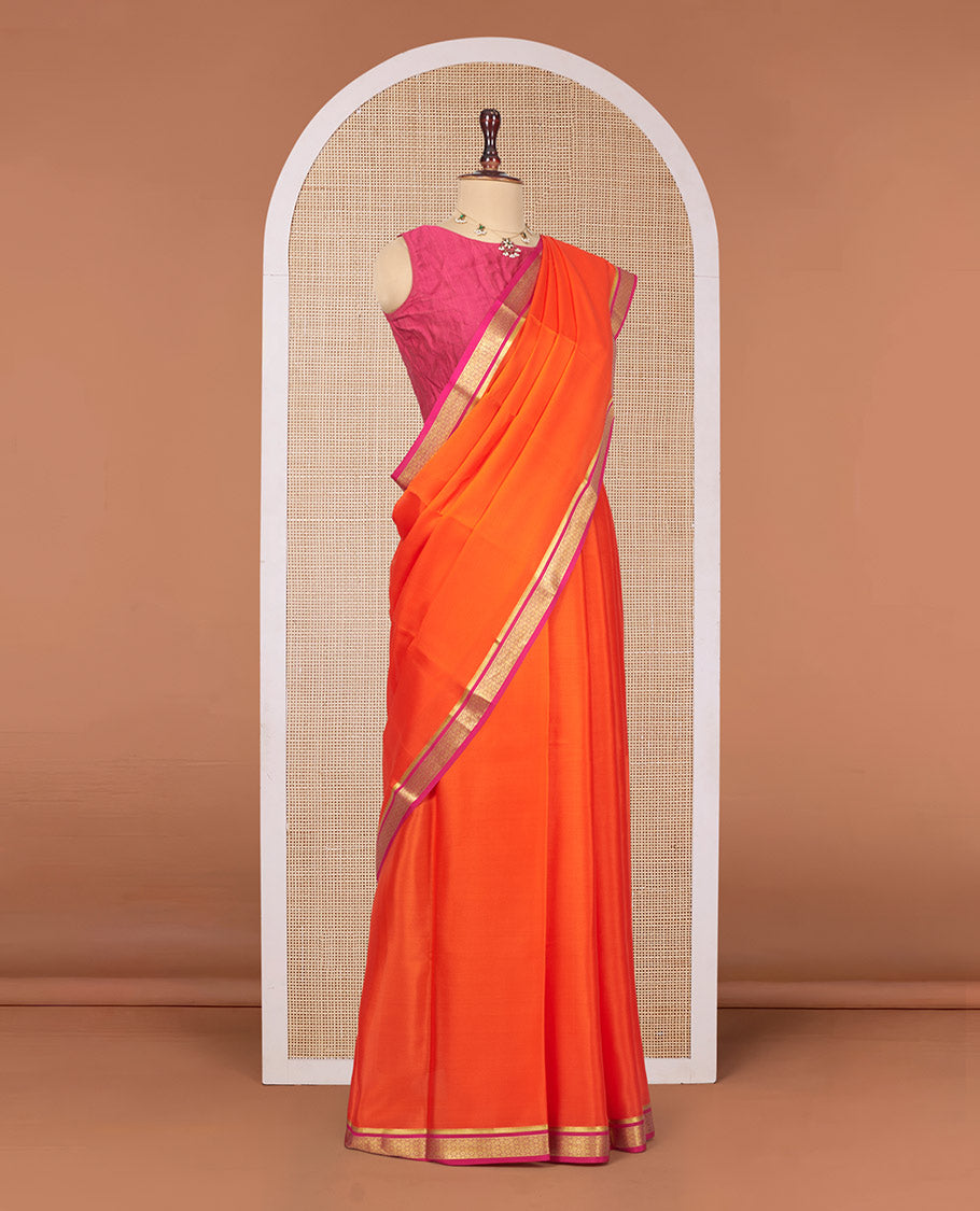 Orange Plain Mysore Silk Saree, Complemented by a Contrast Traditional Zari Design Border, Zari Striped Pallu, and Paired with a Contrast Blouse