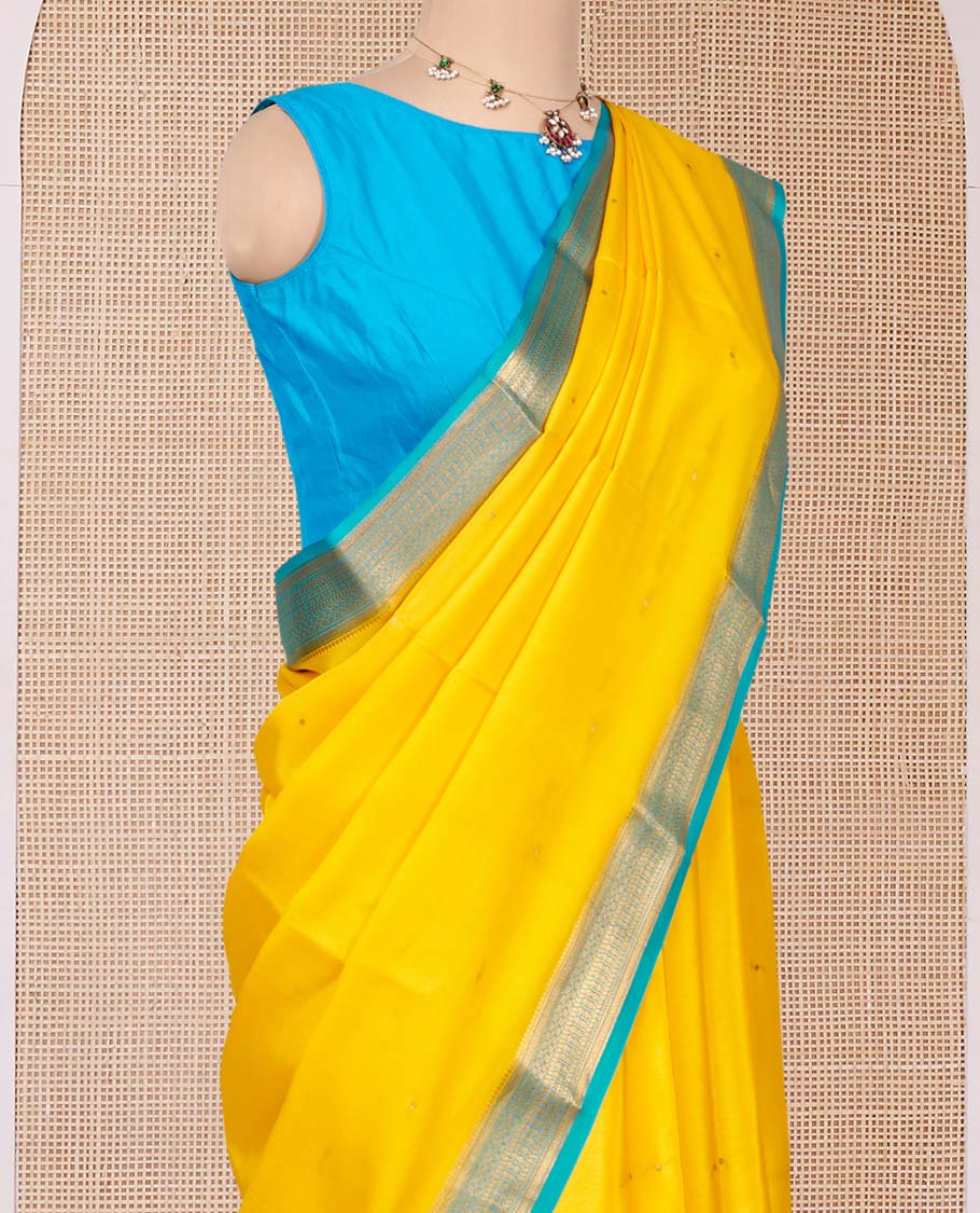 Orange Mysore Silk Saree, Subtly Sparkled with Buttas All Over Its Body, Complemented by a Contrast Traditional Zari Design Border, Zari-Buttas Woven Pallu, and Paired with a Contrast Blouse
