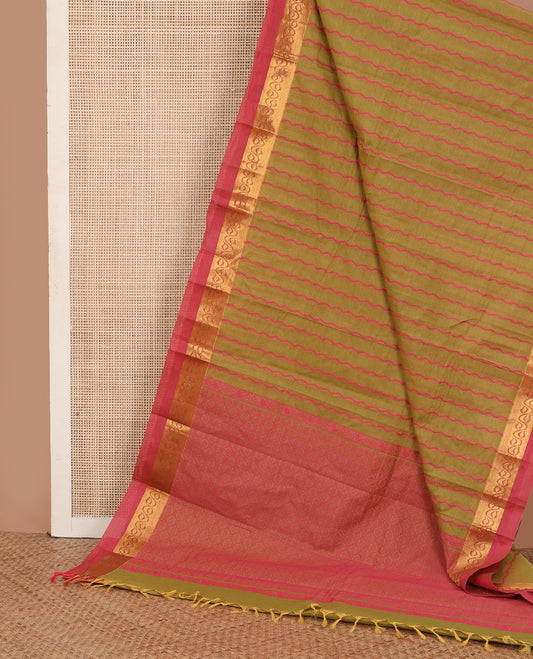 Green zig-zag striped kanchi cotton saree, contrast leaf creeper zari border, and jaal pallu