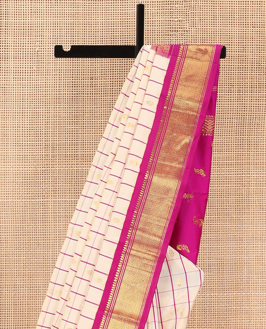 Cream kamalam zari buttas with checked Kanchipuram silk saree, contrast korvai border of thilakam mokku, banaras, and mayil kann designs, and zari design pallu