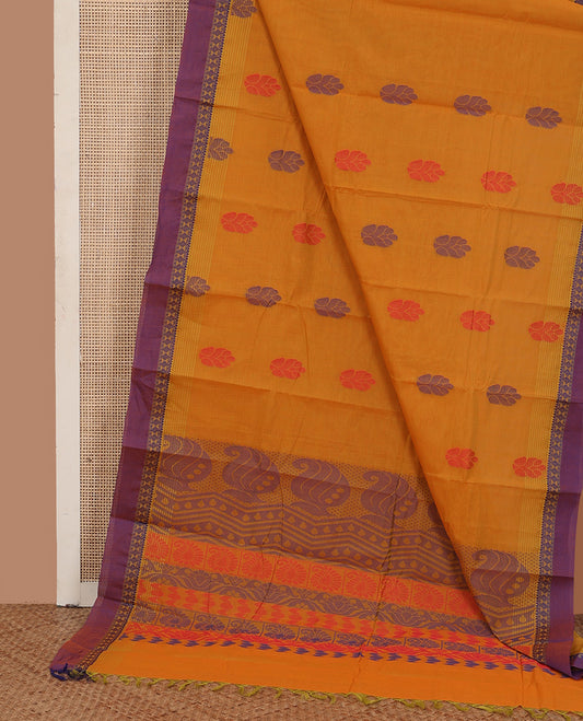 Mustard buttas kanchi cotton saree, contrast traditional motifs border, and pallu of paisley designs