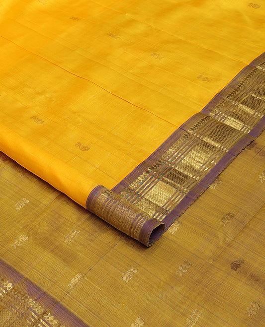 Yellow zari buttas Kanchipuram silk saree, contrast one-sided border of thilakam mokku,banaras,muthu & jaal, & zari design pallu