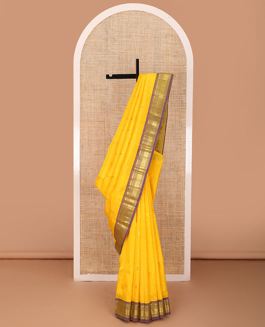 Yellow zari buttas Kanchipuram silk saree, contrast one-sided border of thilakam mokku,banaras,muthu & jaal, & zari design pallu