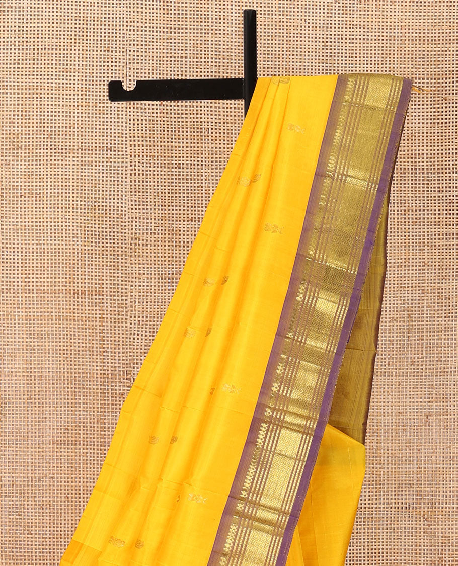 Yellow zari buttas Kanchipuram silk saree, contrast one-sided border of thilakam mokku,banaras,muthu & jaal, & zari design pallu