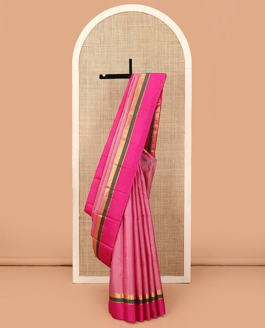 Pink striped Kanchipuram silk saree, contrast rettai pettu border of paneer sombu, vanki, and kathir designs, and zari design pallu
