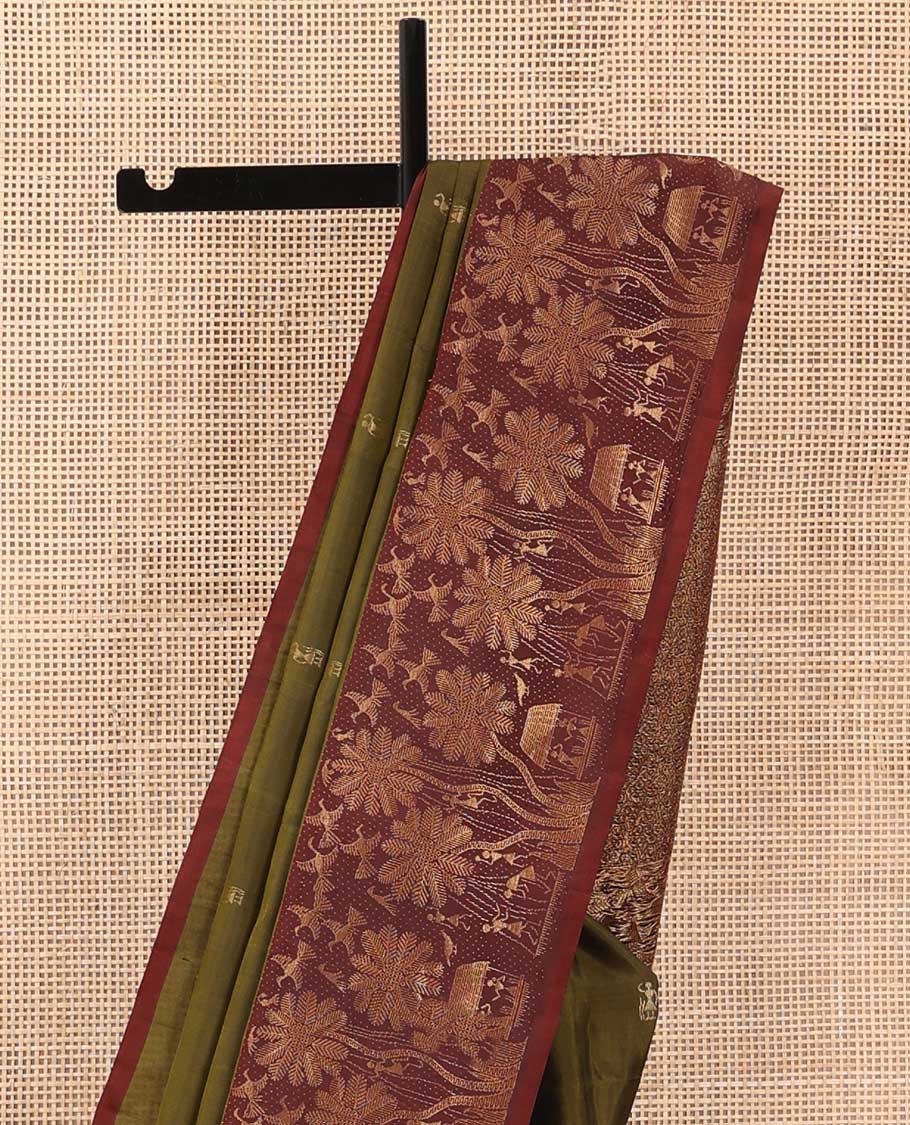 Green warli motifs woven soft silk saree, contrast warli-village theme woven border, and pallu of floral and warli-village theme designs