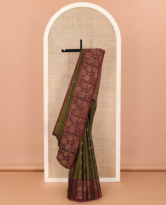 Green warli motifs woven soft silk saree, contrast warli-village theme woven border, and pallu of floral and warli-village theme designs