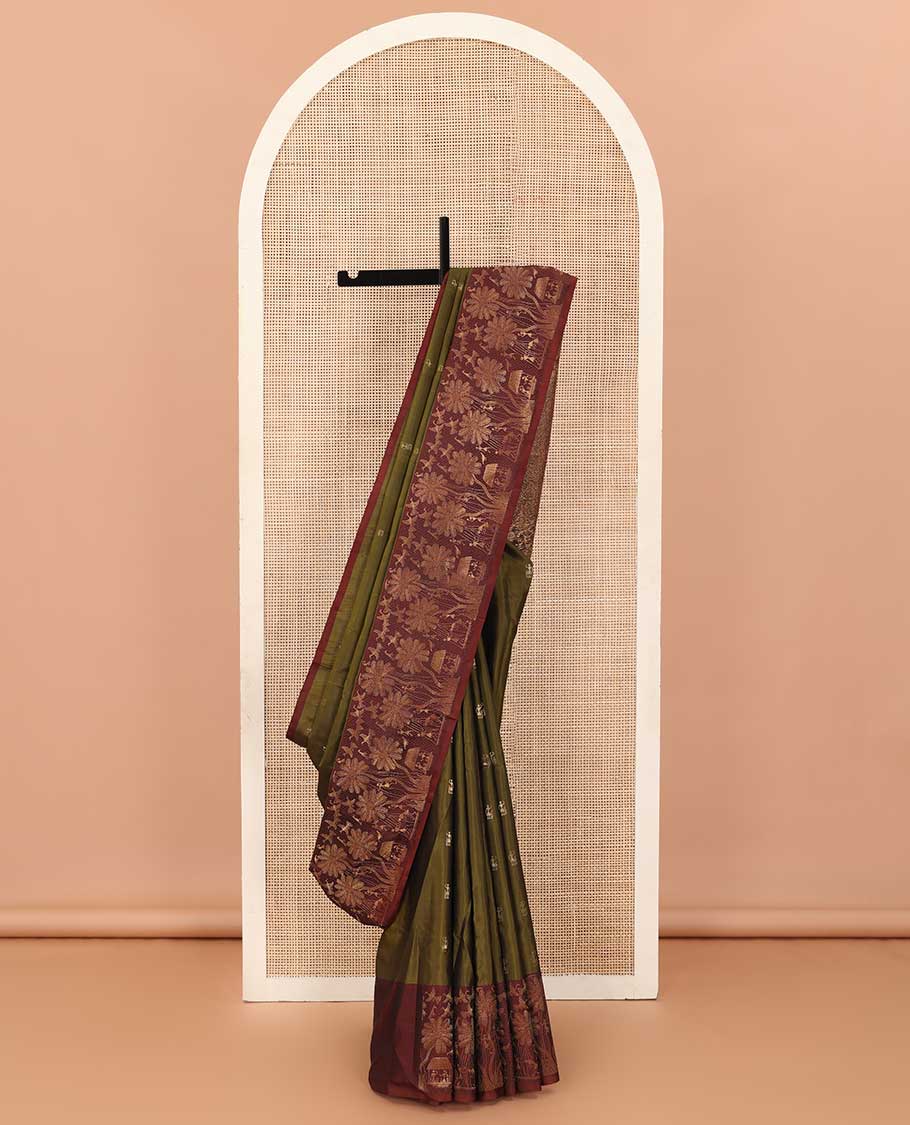 Green warli motifs woven soft silk saree, contrast warli-village theme woven border, and pallu of floral and warli-village theme designs