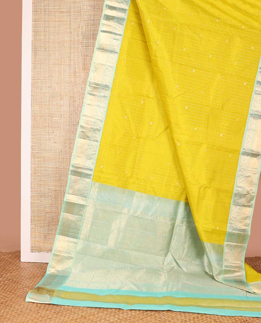 Mustard zari design silk saree, contrast border of thilakam, kathir, and mayil designs, and then kuli kann style oven pallu