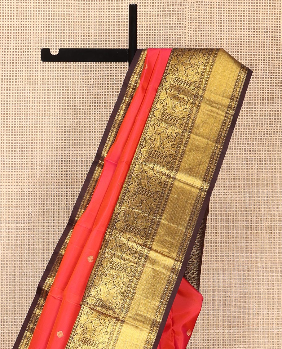 Coral Vasundhara Silk Saree, Elevated with Zari Buttas All Over Its Body, Complemented by a Contrast Border of Manga, Muthu, Kathir, Mayil, and Yaanai Designs, Grand Jaal Pallu, and Paired with a Contrast Blouse