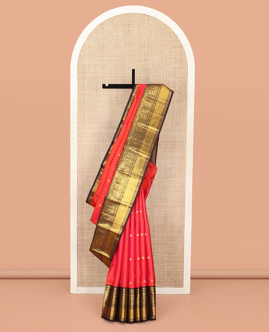 Coral Vasundhara Silk Saree, Elevated with Zari Buttas All Over Its Body, Complemented by a Contrast Border of Manga, Muthu, Kathir, Mayil, and Yaanai Designs, Grand Jaal Pallu, and Paired with a Contrast Blouse
