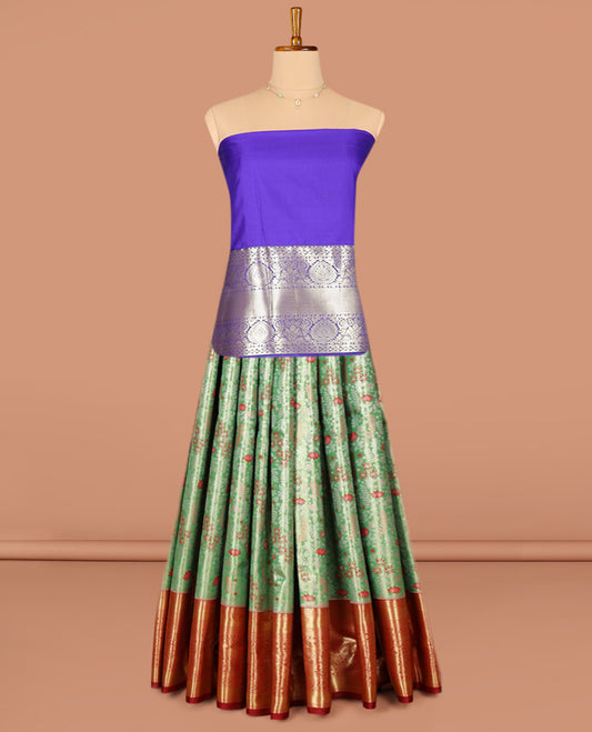 Green Art Silk Pavadai Material Set, Beautifully Bedecked with Floral Jacquard on Its Skirt, Complemented by a Contrast Traditional Zari Designs Border, and Paired with a Contrast Blouse