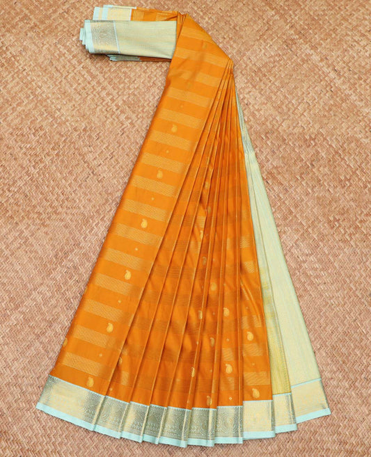 Orange Budget Silk Saree Bedecked with Zari Stripes and Paisley Buttas, Complemented by a Contrast Border of Traditional Zari Designs, Subtly Designed Pallu of Stripes, and Paired with a Contrast Blouse