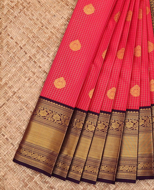 Red Budget Silk Saree, Detailed with Zari Buttas and Checks All Over Its Body, Complemented by a Contrast Zari Border of Traditional Designs, Pallu Features Jaal Designs, and Paired with a Contrast Blouse