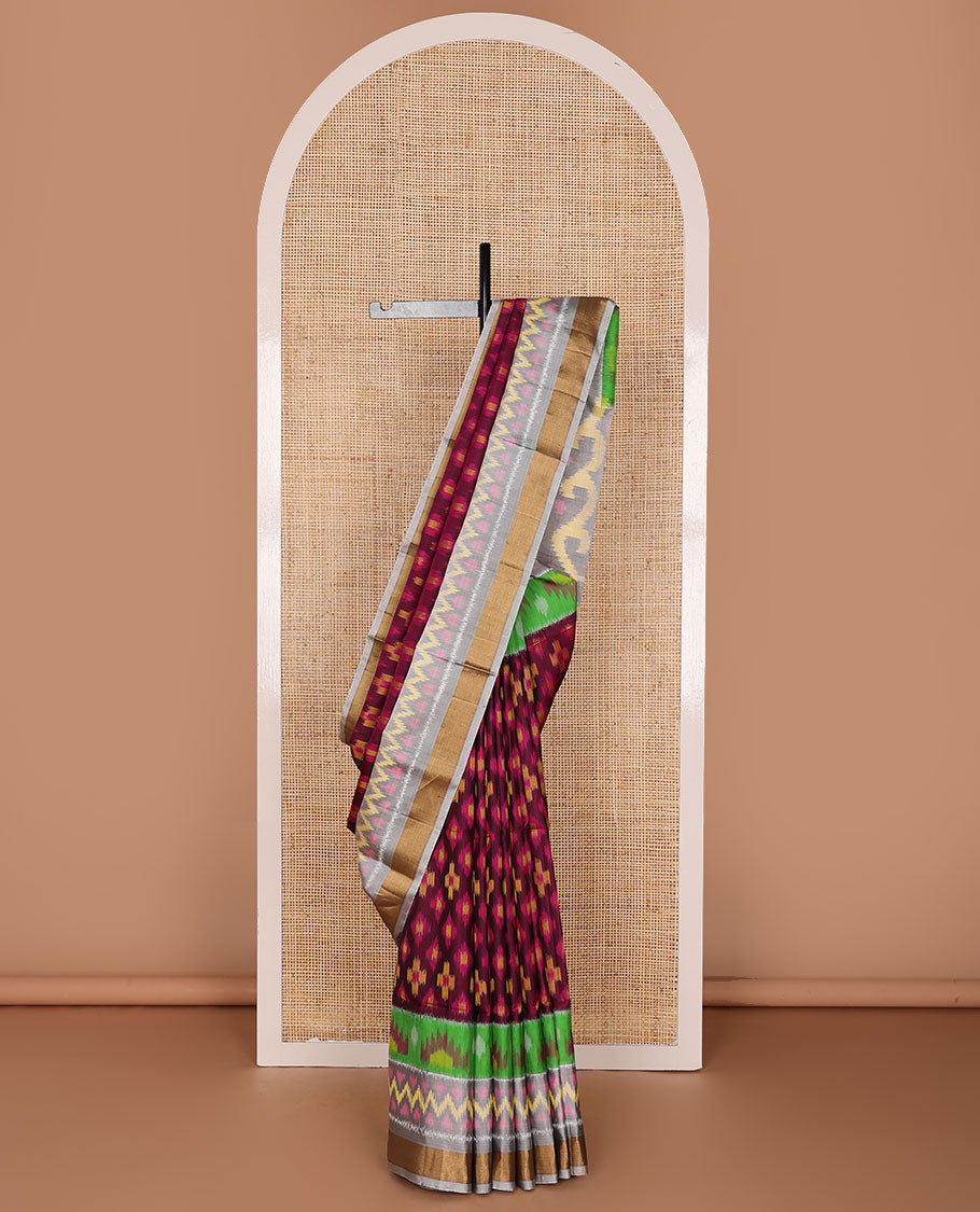 Maroon buttas pure ikkat saree, contrast multi-color geometric patterned ikkat border & pallu