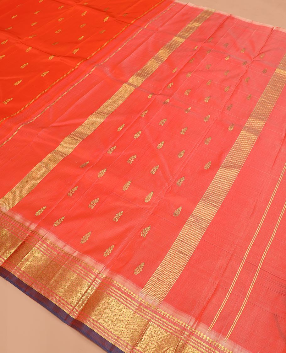 Orange zari buttas Kanchipuram silk saree, contrast one-sided border of paneer sombu, banaras, muthu, and jaal designs, and  zari design pallu