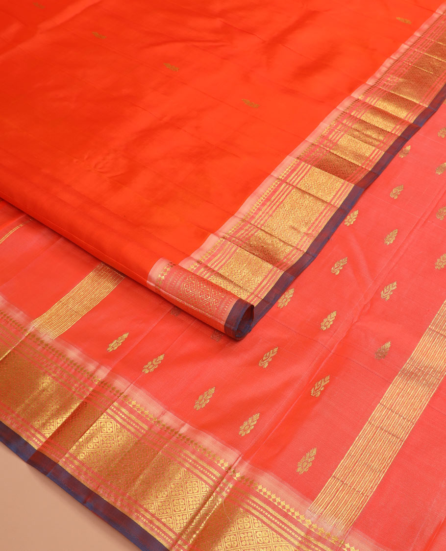Orange zari buttas Kanchipuram silk saree, contrast one-sided border of paneer sombu, banaras, muthu, and jaal designs, and  zari design pallu