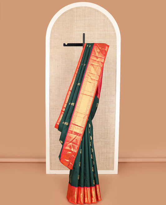 Green manga buttas Kanchipuram silk saree, contrast border of kathir, banaras, mayil, and chakram designs, and intricate pallu