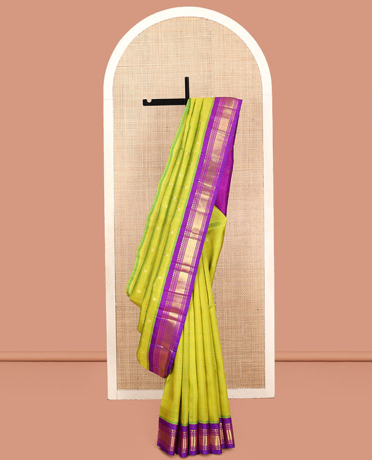 Green Kanchipuram Silk Saree, Detailed with Zari Buttas, Contrast Border of Paneer Sombu, Banaras, Muthu,and Mayil Kann, Zari Design Pallu, and No Blouse
