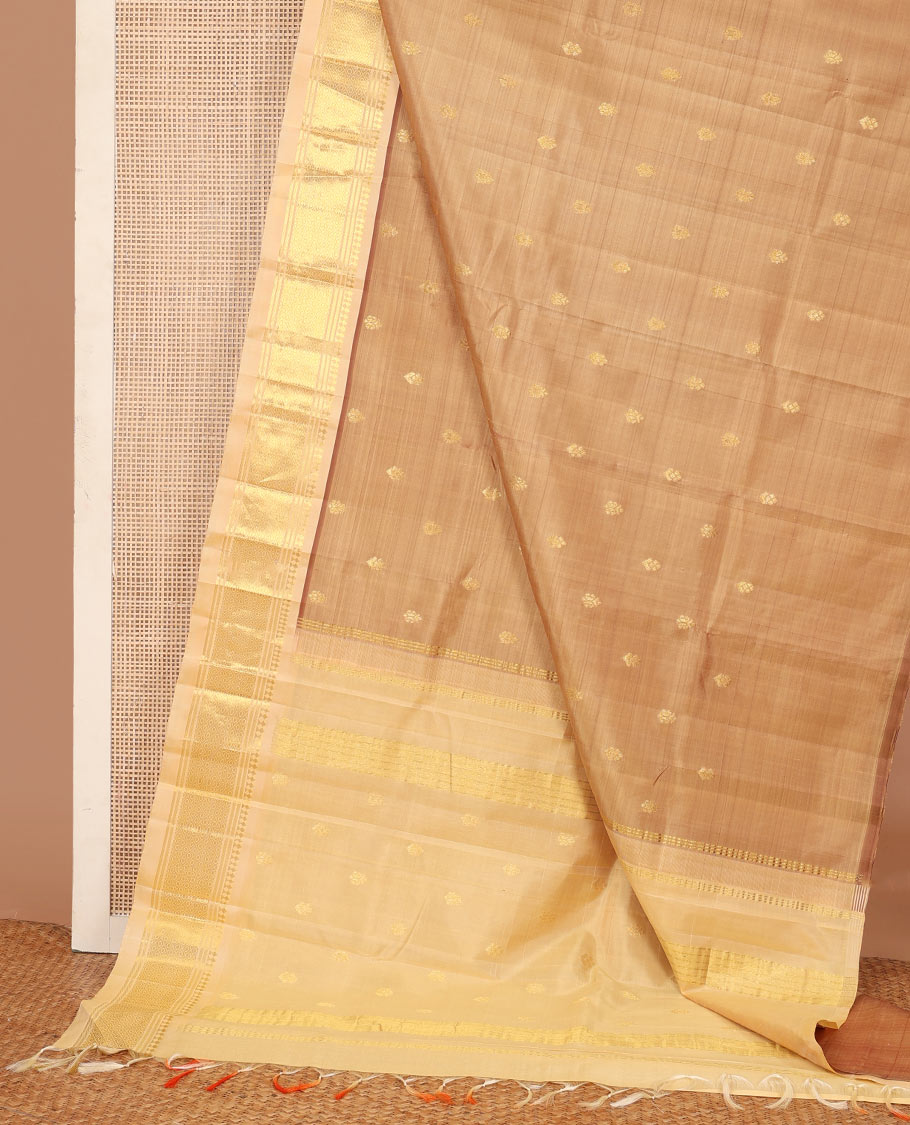 Sandal zari buttas Kanchipuram silk saree, contrast one-sided border of panner sombu, banaras, and mayil kann, and zari woven pallu